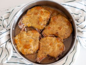 Peach Dijon Pork Chops in a Pan on Top of Kitchen Towel