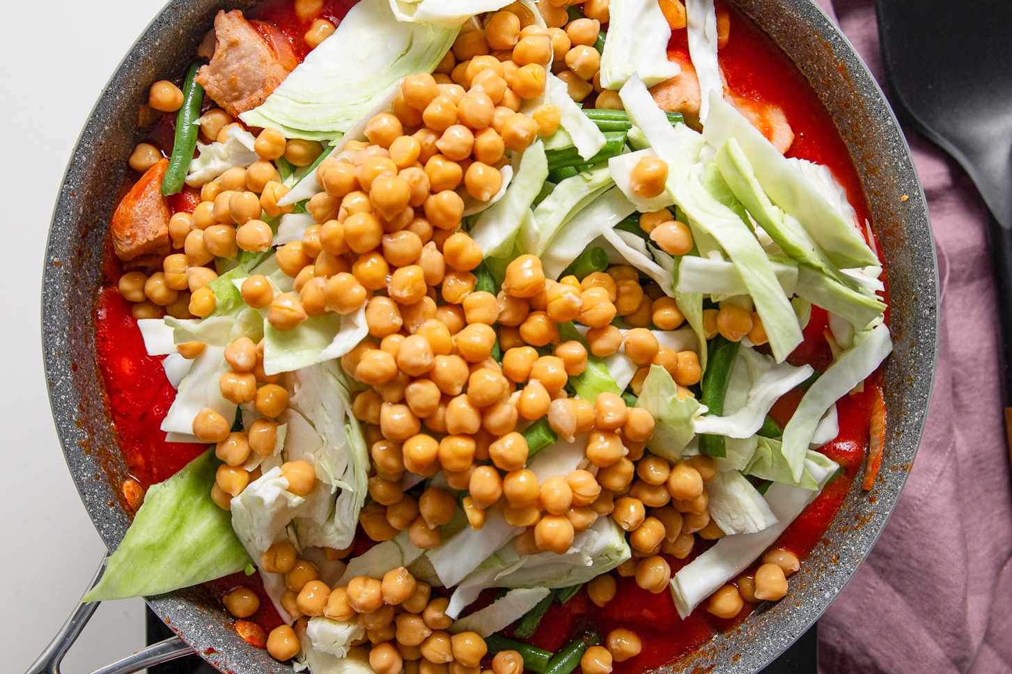 Cabbage, Green Onions, and Chickpeas Added to Pot