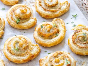 Savory pinwheels on a white platter.