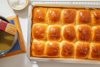 Flaky salt sprinkled onto salted honey rolls (still in the baking pan on the cooling rack)