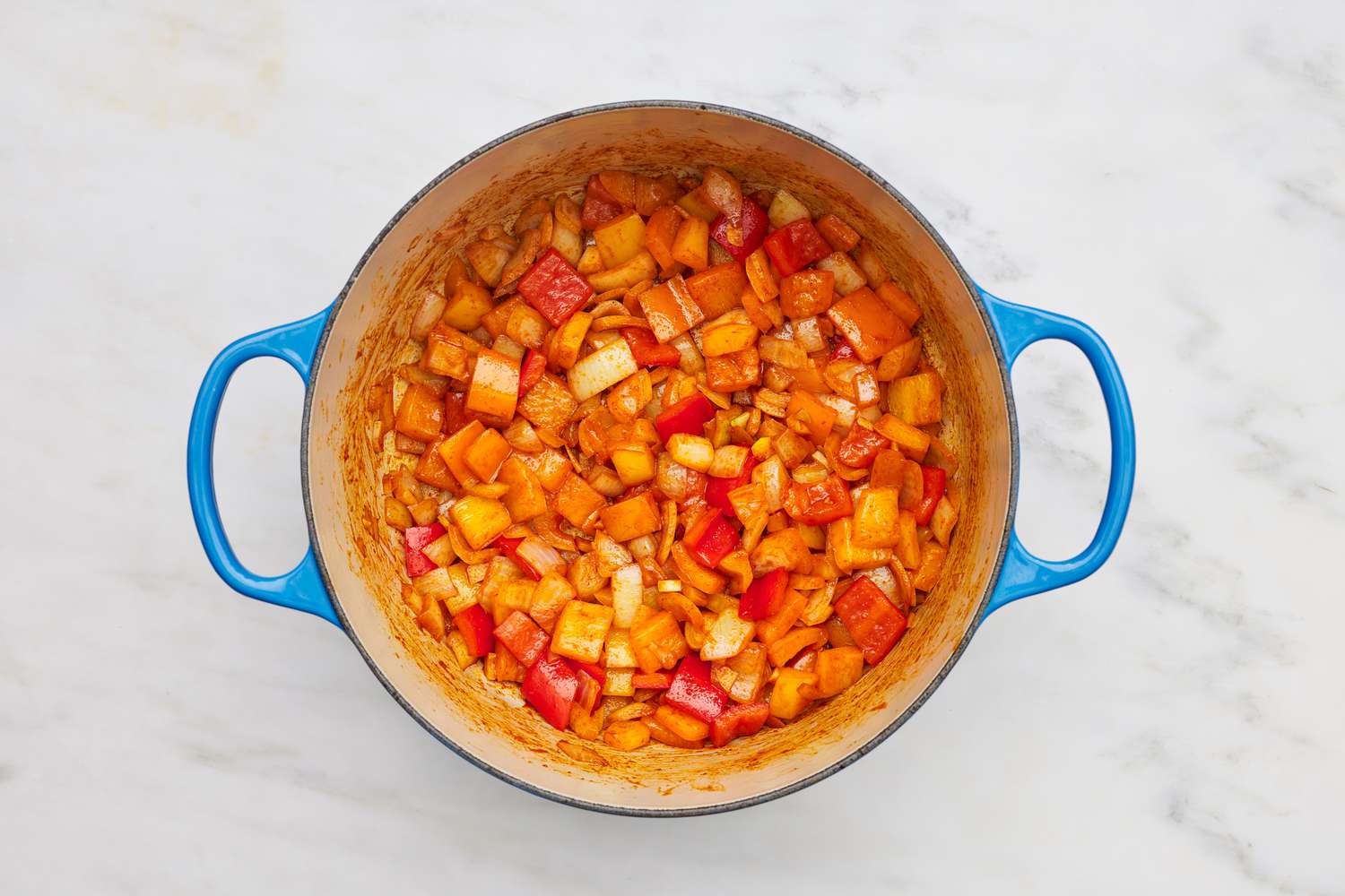 Sauteed vegetables in a dutch oven for stuffed pepper soup recipe