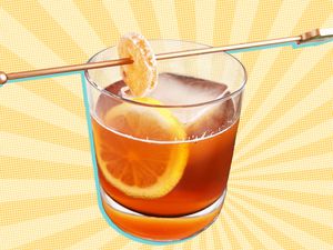 Glass of an autumn cocktail on an illustrated background