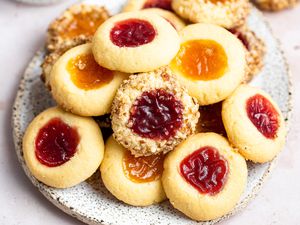 Pile of classic thumbprint cookies on a platter.