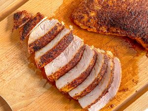 Turkey Tenderloin Sliced on a Cutting Board