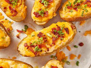 Twice baked potatoes on a piece of parchment paper