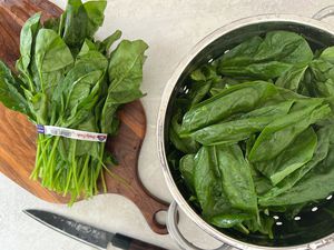 Washed Spinach Drained in Colander for Vegan Creamed Spinach