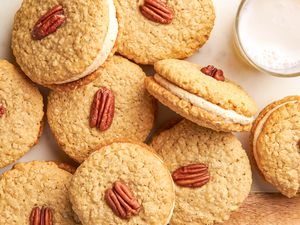 Yellowhammer cookies on the counter next to a glass of milk