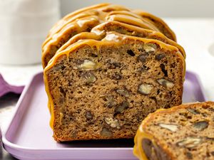 Sliced Banana Pecan Bread With Caramelized White Chocolate Sorghum Glaze on a Platter