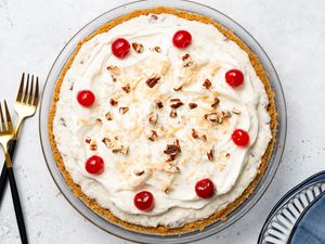 Million Dollar Pie, Forks on the Counter, and a Stack of Plates